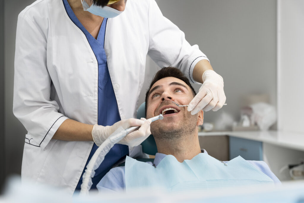 Smiling patient receiving dental care at a local general dentist in Edmonton's Mainstreet Dental Clinic