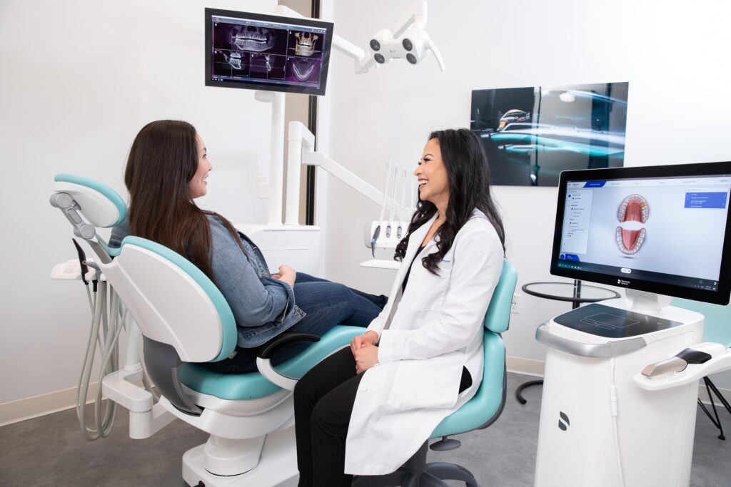 Dentist consulting a patient after an oral cancer screening in Edmonton