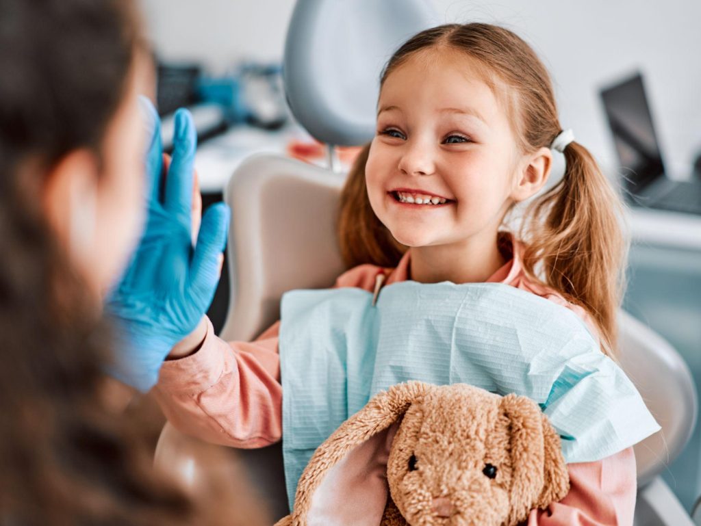 Pediatric dentist examining a child at Mainstreet Dental Clinic in Edmonton